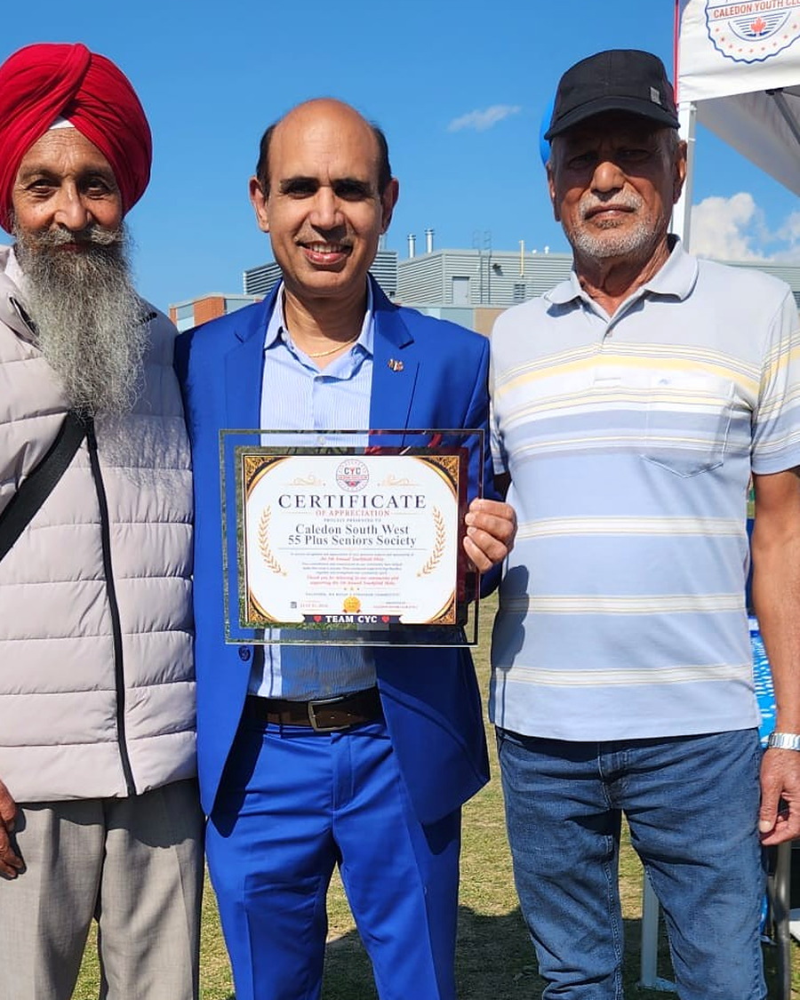 Yogi Chahal with two community members at a Caledon Youth Club event